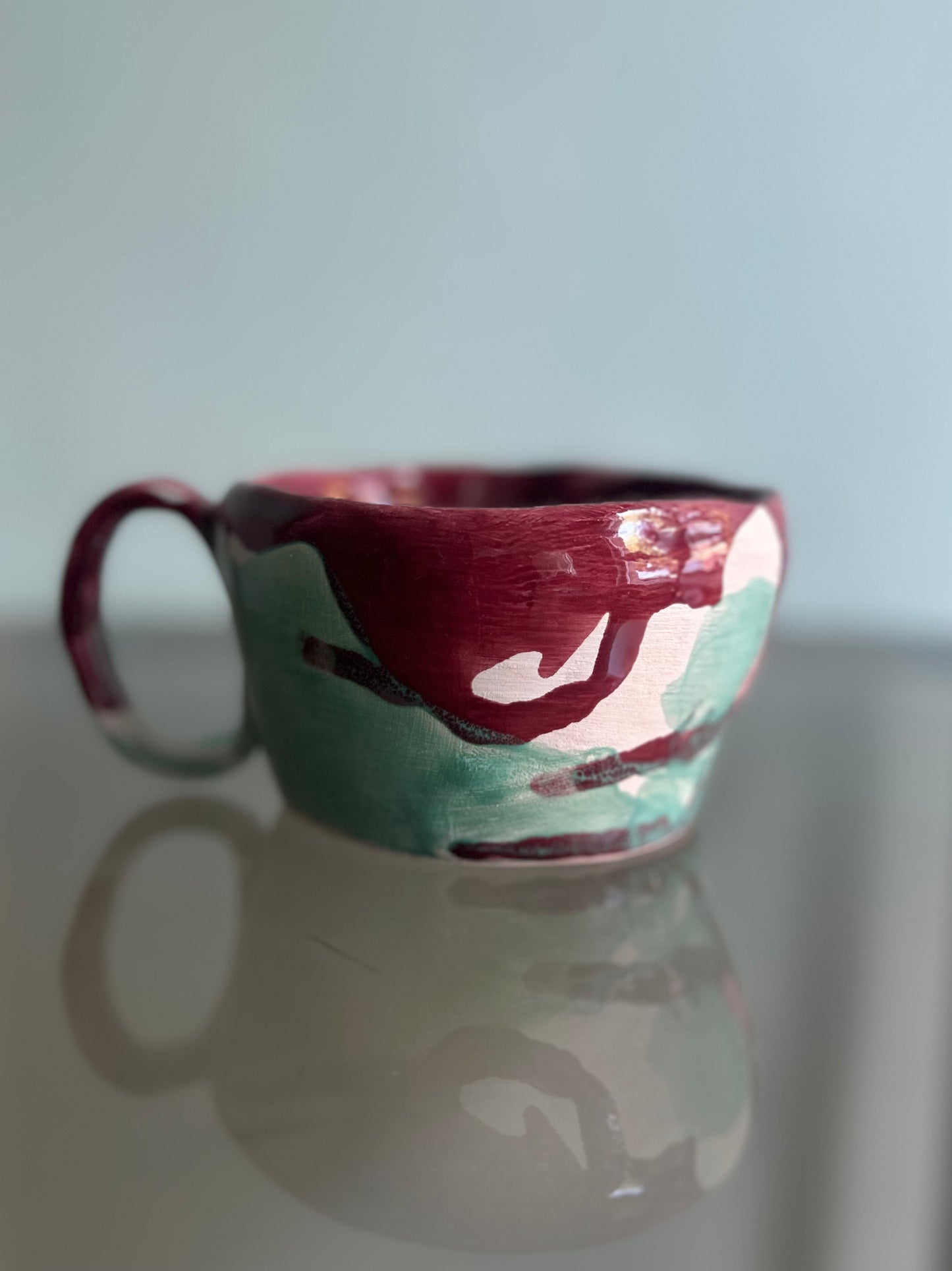 Tazza verde acqua e rossa rubino
