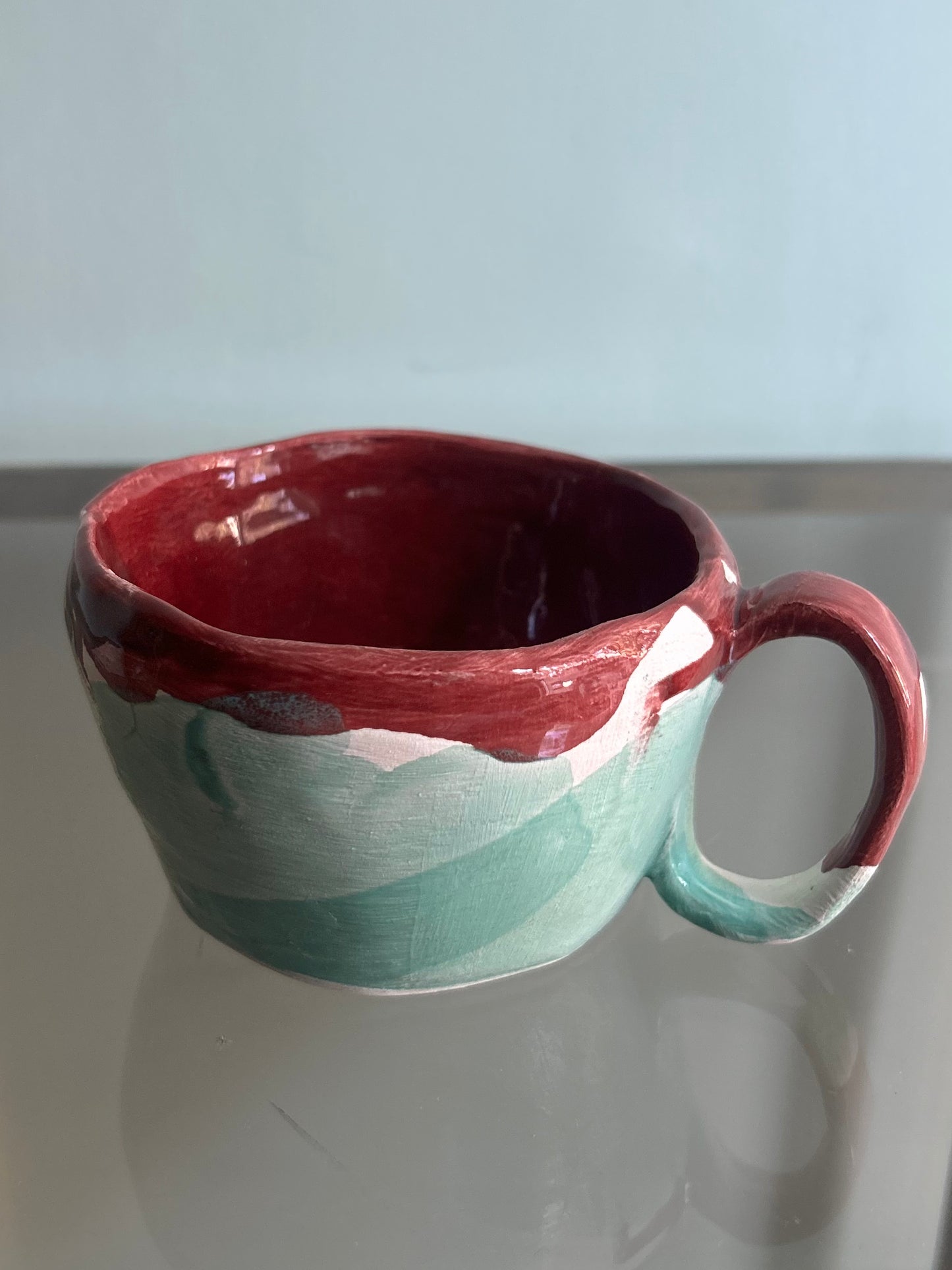 Tazza verde acqua e rossa rubino